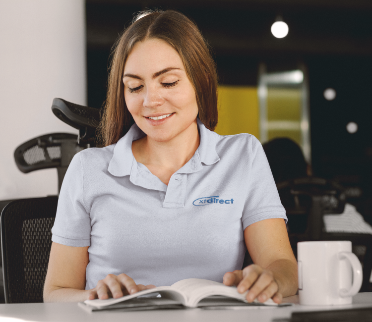 polo-shirt-mockup-of-a-woman-reading-a-book-at-the-office-a8203